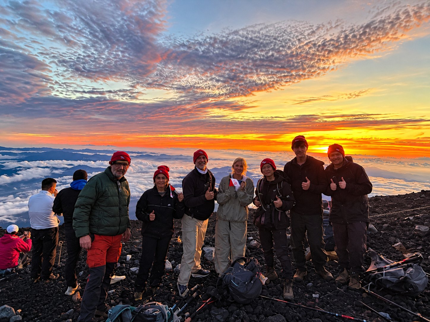 Kraus and Garriott families at the Mount Fuji summit at sunrise