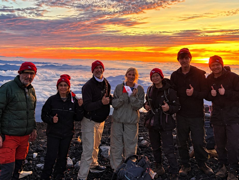 Kraus and Garriott families at Mount Fuji summit at sunrise