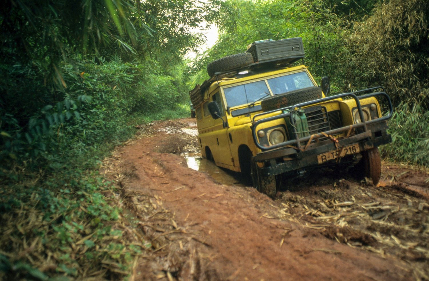 Yellow Land Rover Twiga on a rough African road